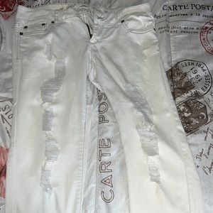 White cut up pants